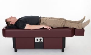 man laying on ComfortWave hydromassage table